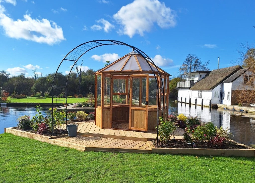 Spacious interior of Wellow Wooden Garden Greenhouse providing ample space for plant growth