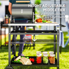 Outsunny BBQ Trolley with Stainless Steel Top Adjustable Shelf, Outdoor Kitchen BBQ Station with Hooks Seasoning Tray Towel Rack, Pizza Oven Table Movable Outdoor Grill Dining Cart with Cover, Black - anydaydirect
